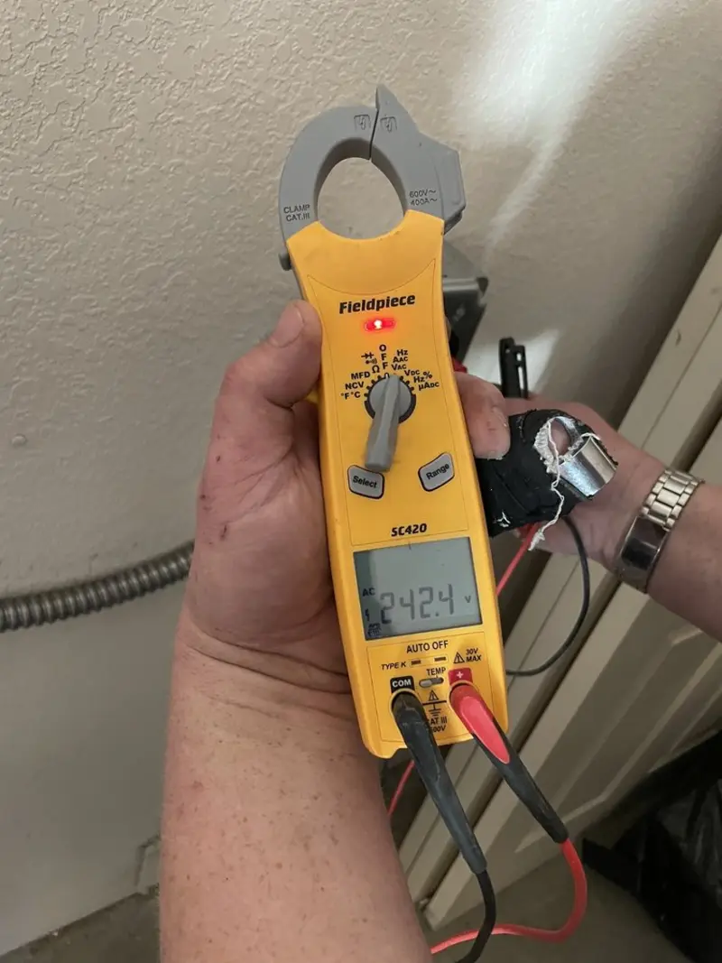 Voltage testing with clamp meter during Outlet Installation in Crest Hill